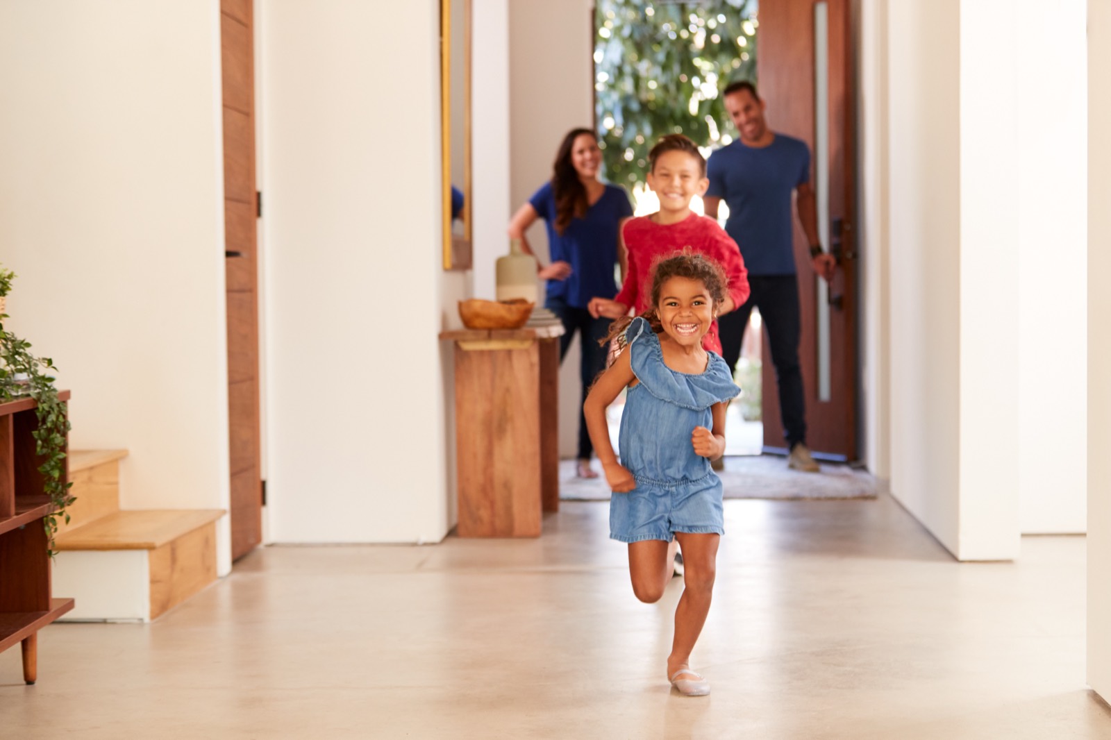 A family arriving at the home they just closed on